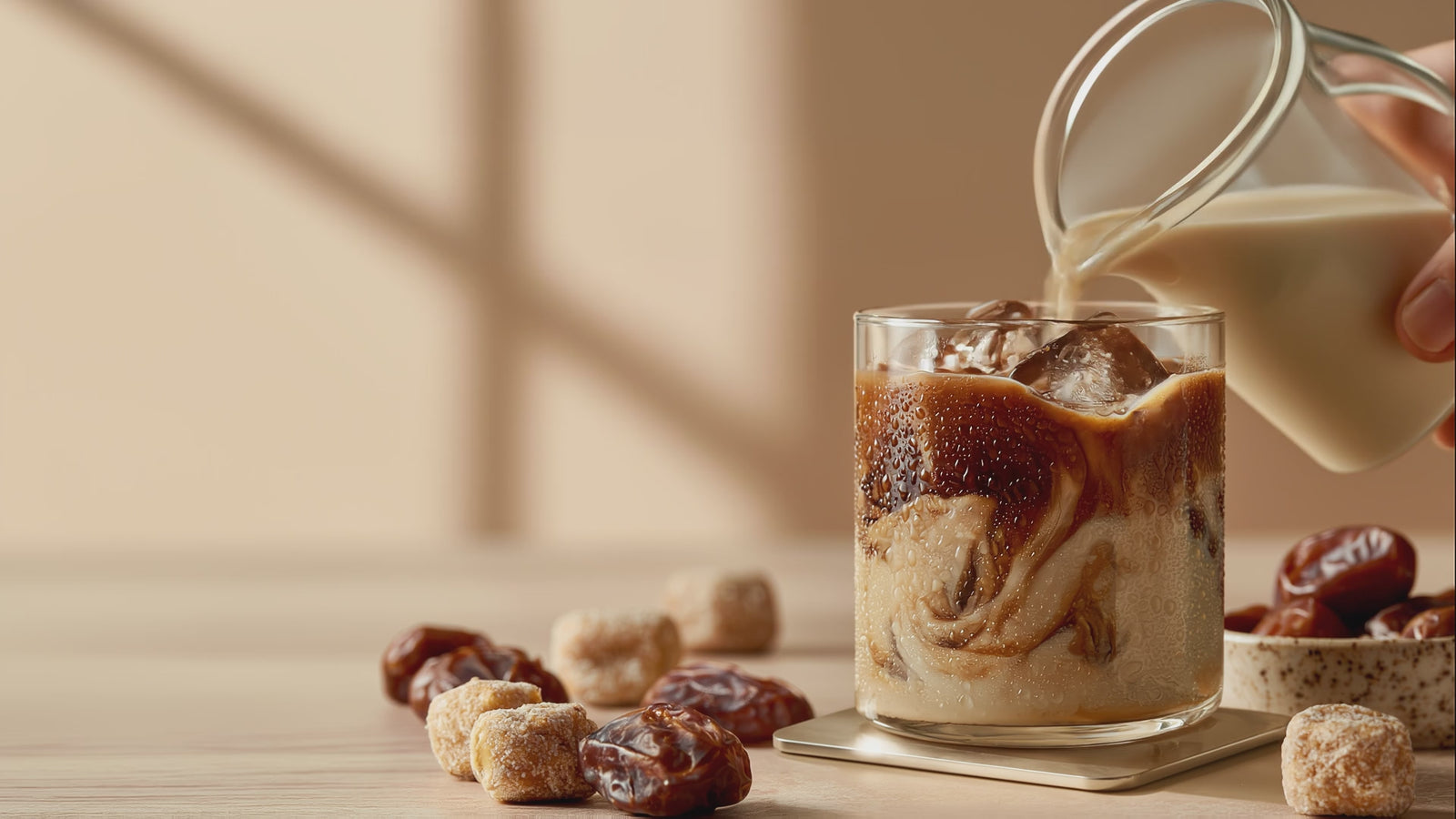 alt milk pouring into iced latte